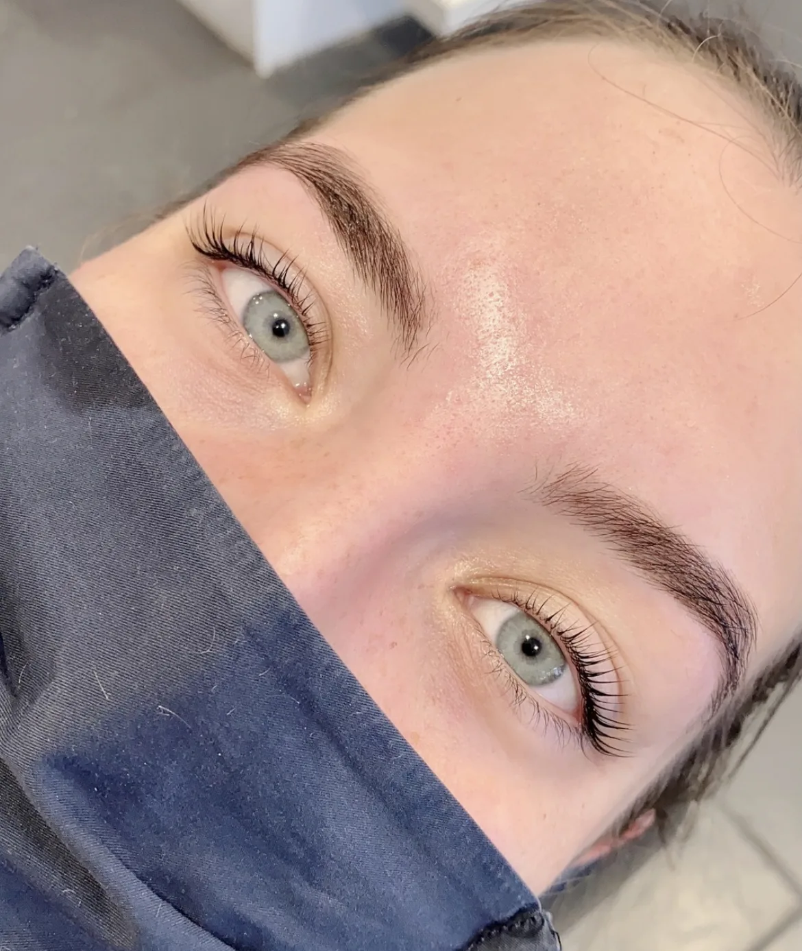 Overhead view of both eyes with shaped brows and lifted lashes